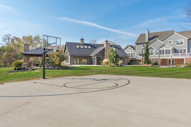 view of sport court with a gazebo and a lawn