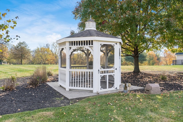 exterior space with a gazebo and a yard