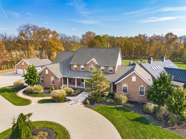 view of front of property with covered porch and a front yard