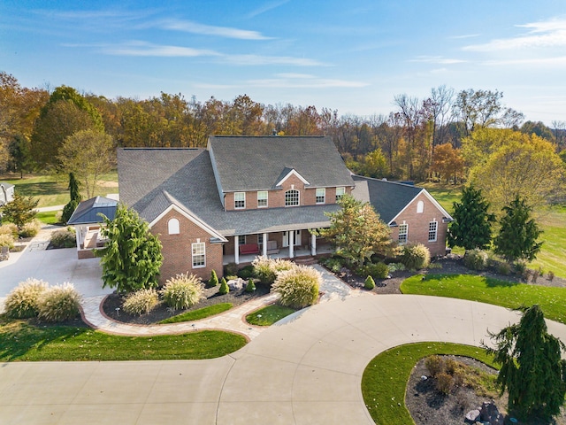 10492 Allen Rd, Pickerington, OH 43147 - view of front of home with a porch, curved driveway, and brick siding