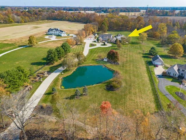 bird's eye view with a water view and a rural view