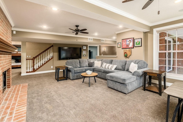 carpeted living room with a brick fireplace, ceiling fan, and ornamental molding