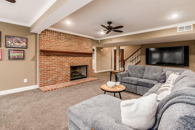 living room with a fireplace, ceiling fan, ornamental molding, and carpet floors