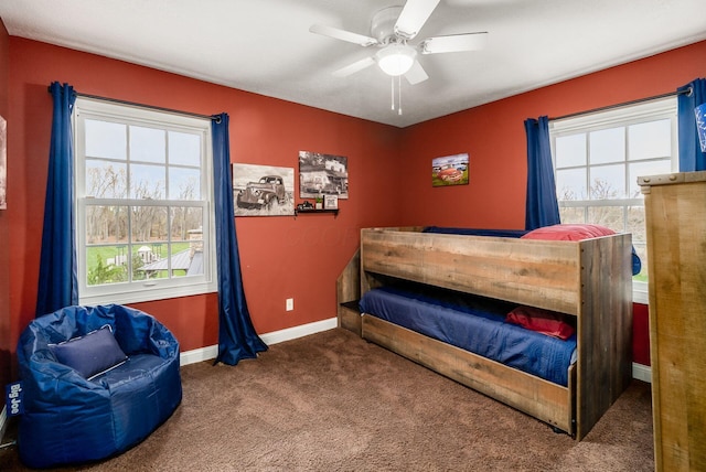 carpeted bedroom with ceiling fan