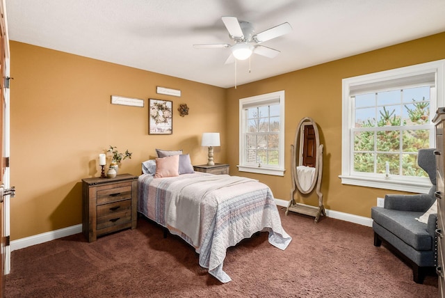 bedroom with ceiling fan and dark carpet