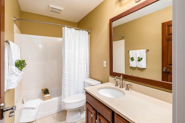 full bathroom featuring tile patterned flooring, a textured ceiling, toilet, shower / bath combo with shower curtain, and vanity