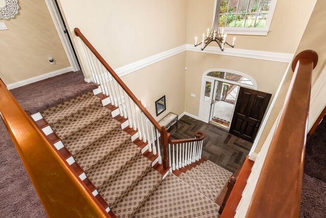 10492 Allen Rd, Pickerington, OH 43147 - entryway with a chandelier, stairs, and a high ceiling