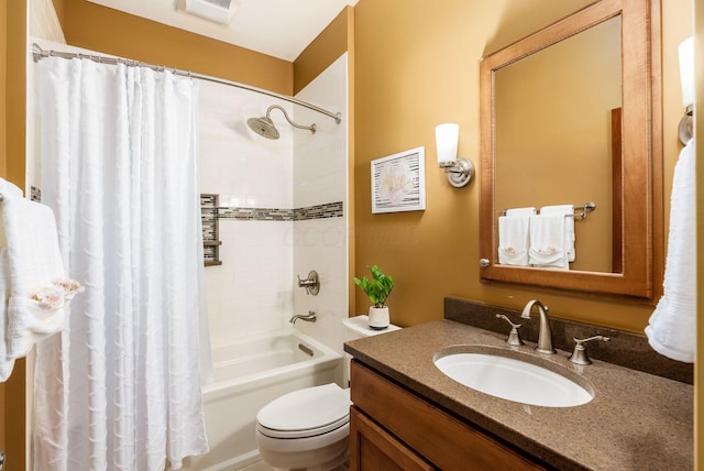 full bathroom featuring shower / bath combo, vanity, and toilet