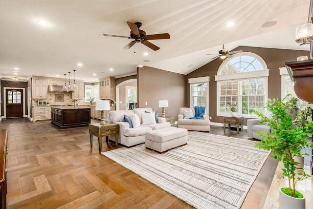 living room featuring ceiling fan, vaulted ceiling, and parquet flooring