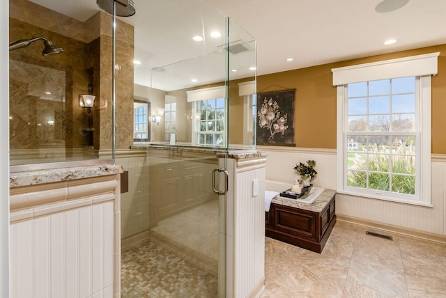 10492 Allen Rd, Pickerington, OH 43147 - full bath with a stall shower, wainscoting, healthy amount of natural light, a bath, and recessed lighting