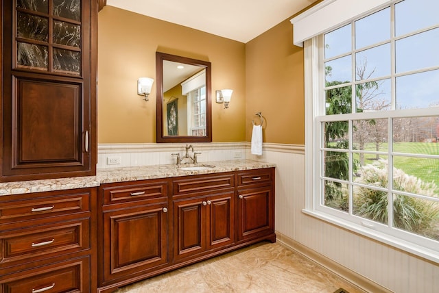 bathroom with vanity and plenty of natural light