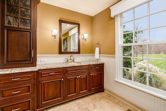 10492 Allen Rd, Pickerington, OH 43147 - bathroom with wainscoting, vanity, and healthy amount of natural light