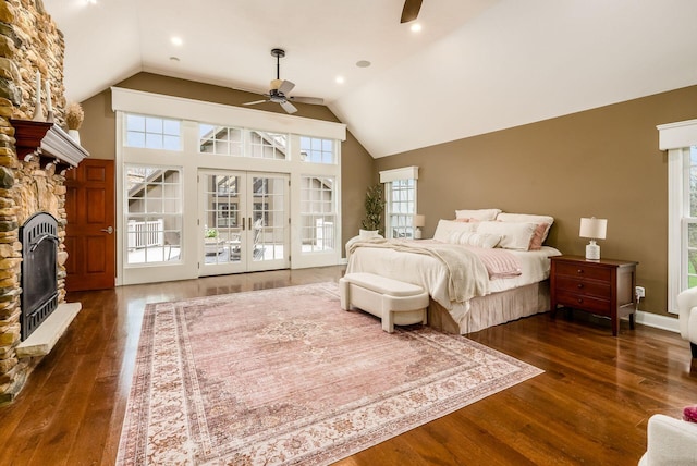 10492 Allen Rd, Pickerington, OH 43147 - bedroom with a stone fireplace, vaulted ceiling, wood finished floors, access to outside, and a ceiling fan