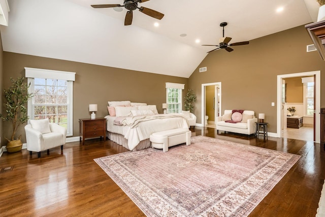 bedroom with ceiling fan, dark hardwood / wood-style flooring, and high vaulted ceiling