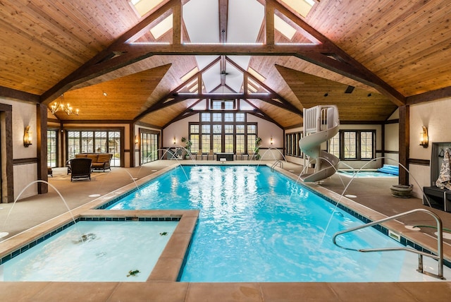 view of pool featuring a patio area and a water slide