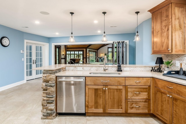 kitchen featuring dishwasher, french doors, hanging light fixtures, sink, and tasteful backsplash