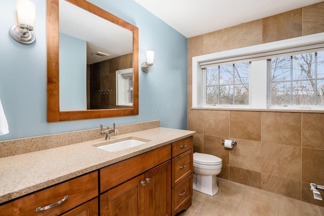 10492 Allen Rd, Pickerington, OH 43147 - bathroom with vanity, tile patterned floors, and tile walls