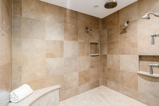 bathroom featuring tiled shower