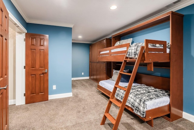 carpeted bedroom with ornamental molding