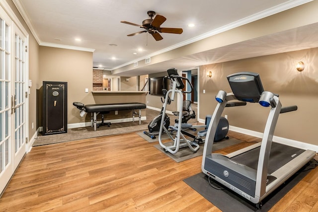 workout area with ceiling fan, light wood-type flooring, and crown molding