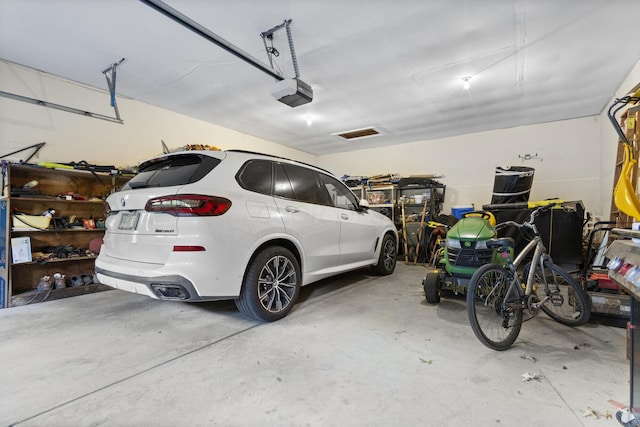 garage featuring a garage door opener