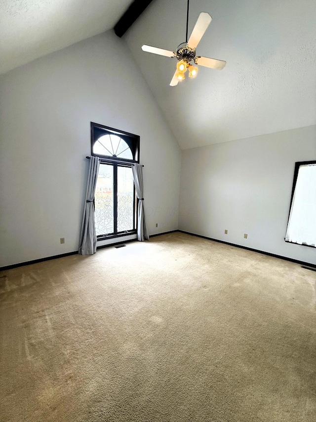additional living space featuring baseboards, a ceiling fan, carpet flooring, high vaulted ceiling, and beam ceiling