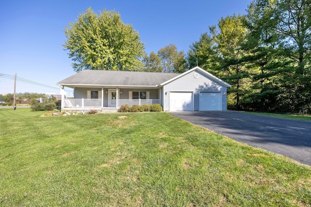 ranch-style home with a porch, a garage, and a front lawn