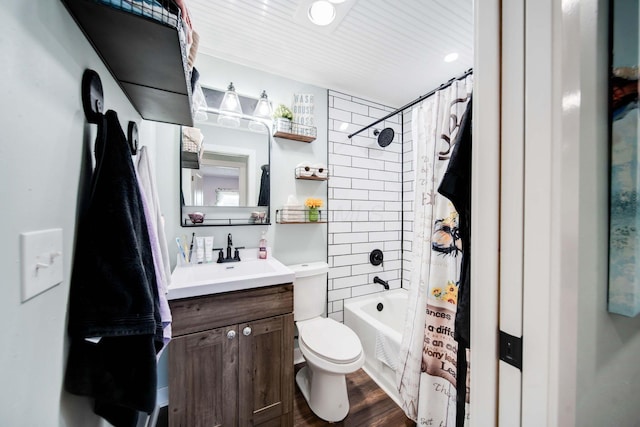 full bathroom featuring vanity, toilet, shower / bathtub combination with curtain, and hardwood / wood-style flooring