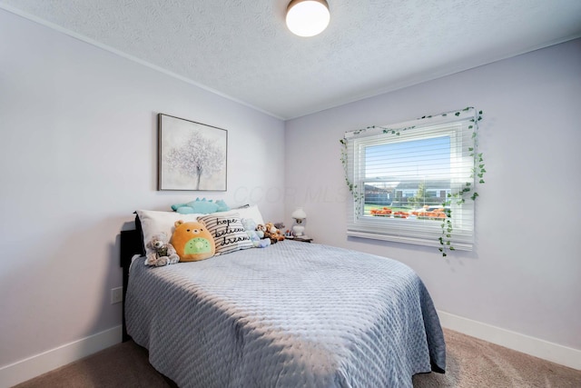 bedroom with carpet flooring and a textured ceiling