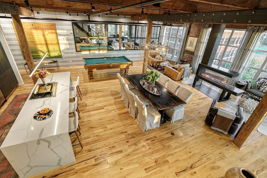 interior space with pool table, track lighting, light hardwood / wood-style floors, and plenty of natural light