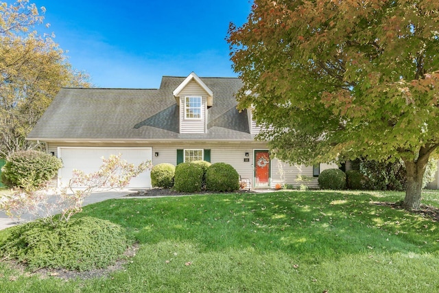 cape cod home with an attached garage, a front lawn, concrete driveway, and roof with shingles