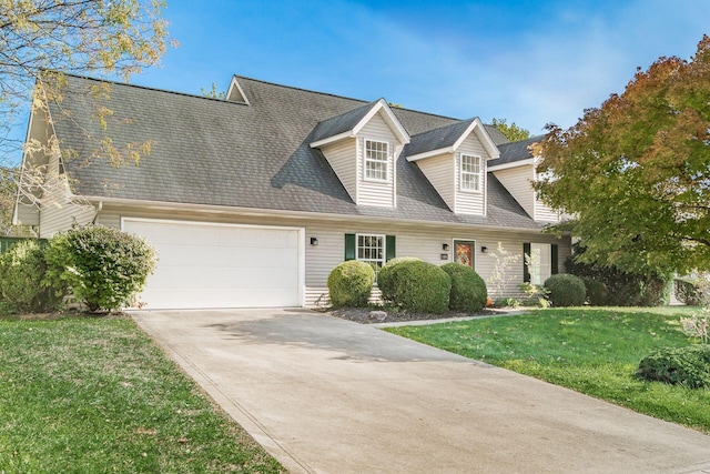 cape cod-style house featuring a garage, concrete driveway, a front lawn, and roof with shingles