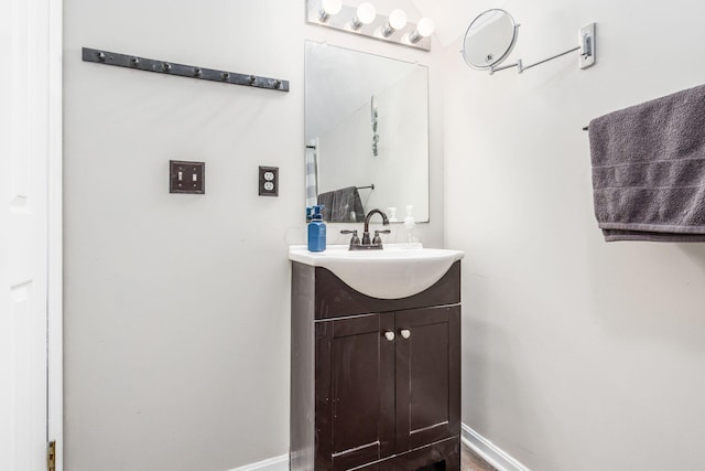 bathroom featuring vanity and baseboards