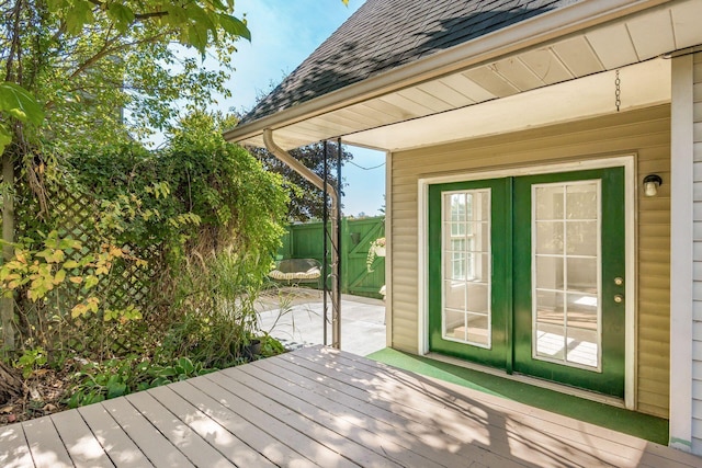 wooden deck featuring french doors and fence