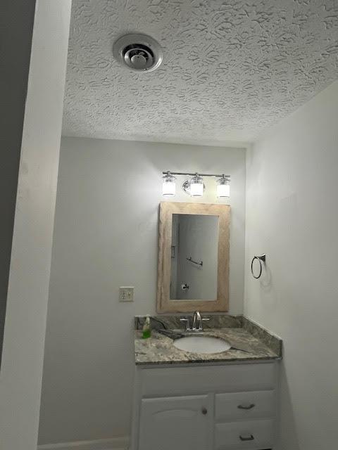 641/2 N Beaver St, Carroll, OH 43112 - bathroom featuring vanity and a textured ceiling