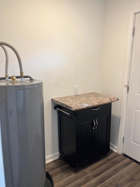 641/2 N Beaver St, Carroll, OH 43112 - laundry area with water heater and dark wood-style floors