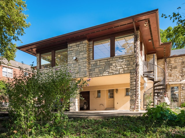 rear view of property featuring a patio