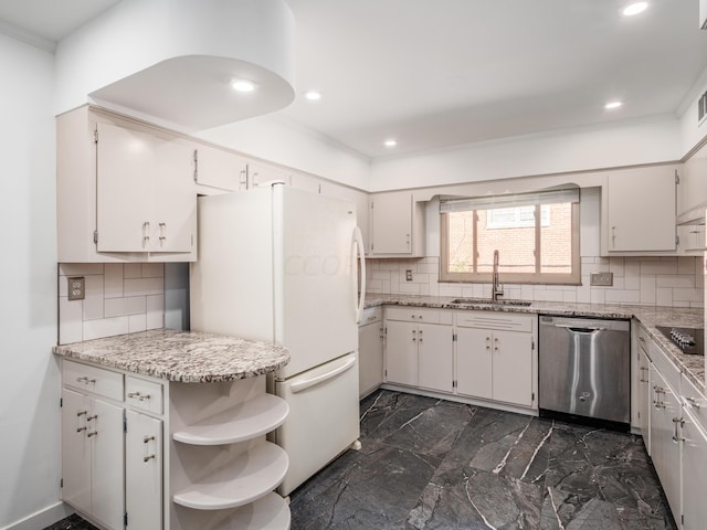 kitchen featuring decorative backsplash, white cabinets, sink, white refrigerator, and dishwasher