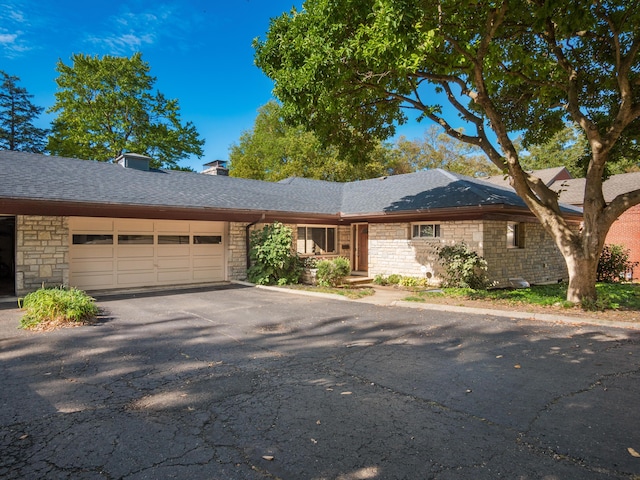 single story home with a garage