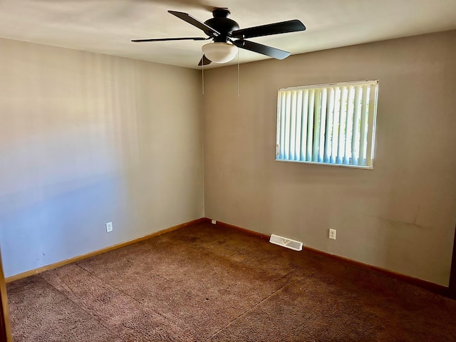 spare room featuring carpet flooring and ceiling fan