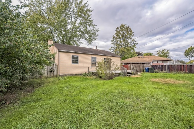 view of yard featuring a wooden deck