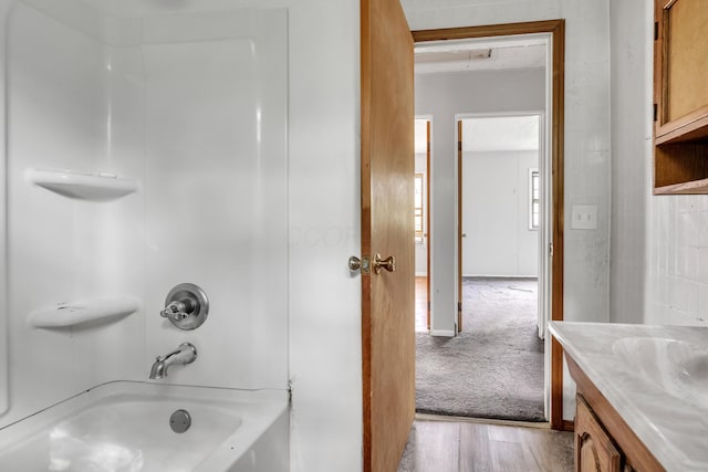 bathroom featuring shower / tub combination, vanity, and wood-type flooring