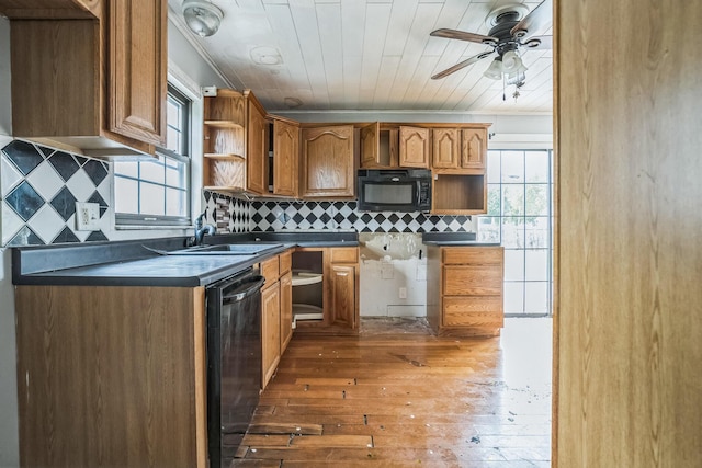 kitchen with tasteful backsplash, ornamental molding, ceiling fan, dark wood-type flooring, and black appliances