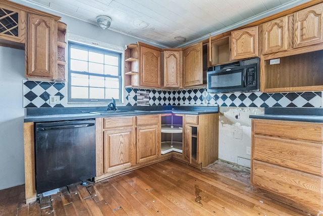 kitchen featuring black appliances, decorative backsplash, sink, and dark wood-type flooring