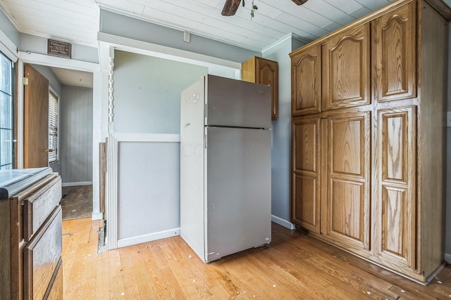 kitchen featuring ceiling fan, wooden ceiling, stainless steel fridge, light wood-type flooring, and ornamental molding