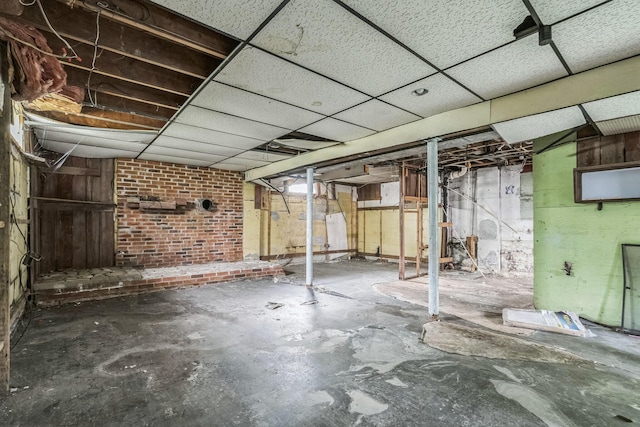 basement featuring a drop ceiling