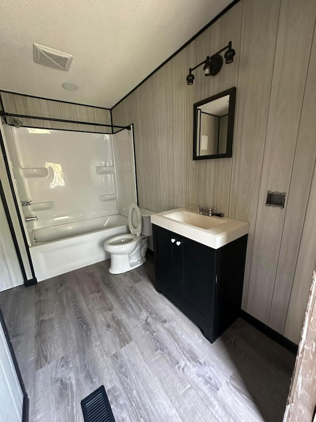 8565 Smith Calhoun Rd Unit 162, Plain City, OH 43064 - full bath with bathing tub / shower combination, vanity, wood finished floors, a textured ceiling, and wood walls