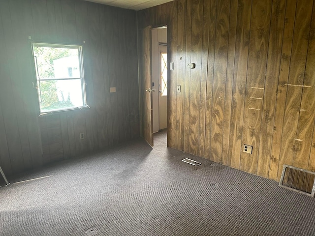 8565 Smith Calhoun Rd Unit 162, Plain City, OH 43064 - empty room with carpet floors and wooden walls