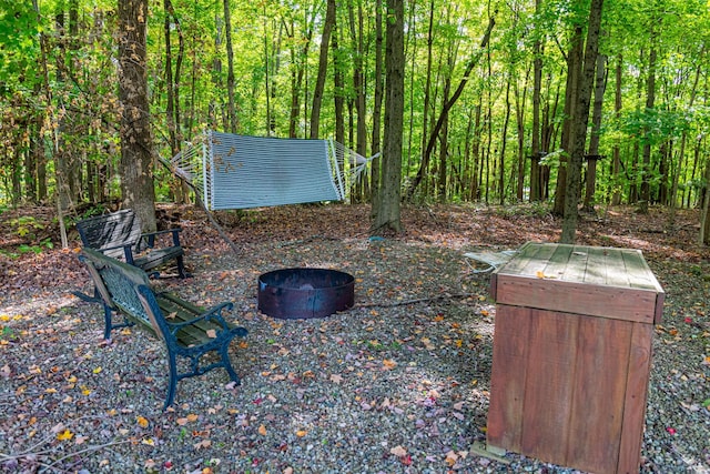 view of yard featuring a fire pit