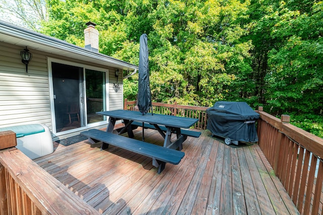 wooden terrace with a grill